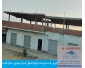 4 magasins et carcasse d`appartements